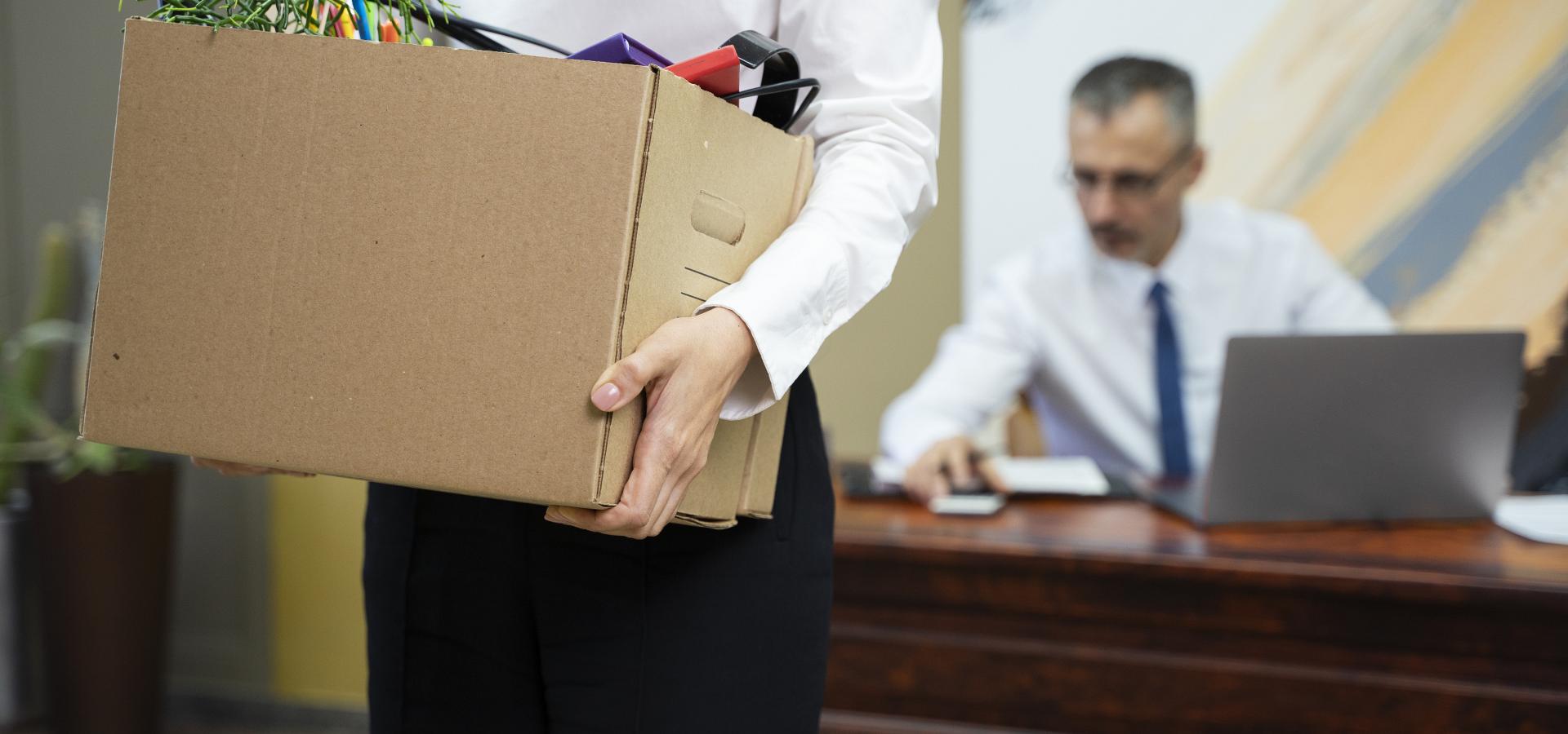 woman carrying cardboard box side view(1)