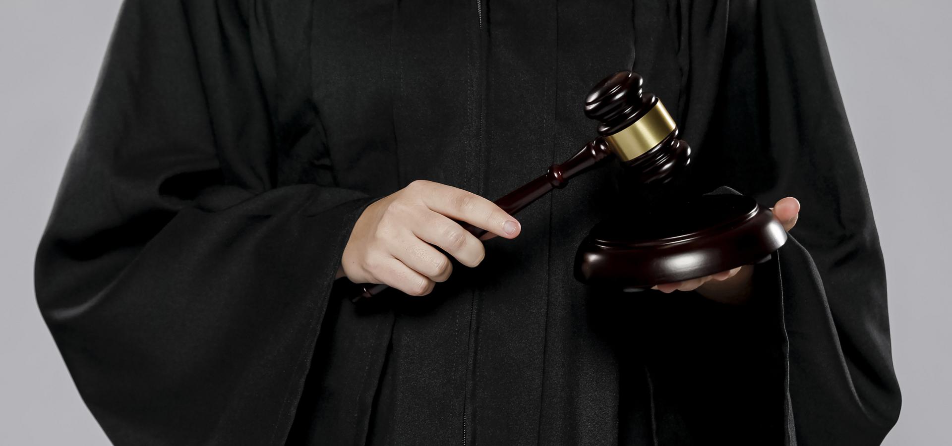 front view female judge with gavel(1)